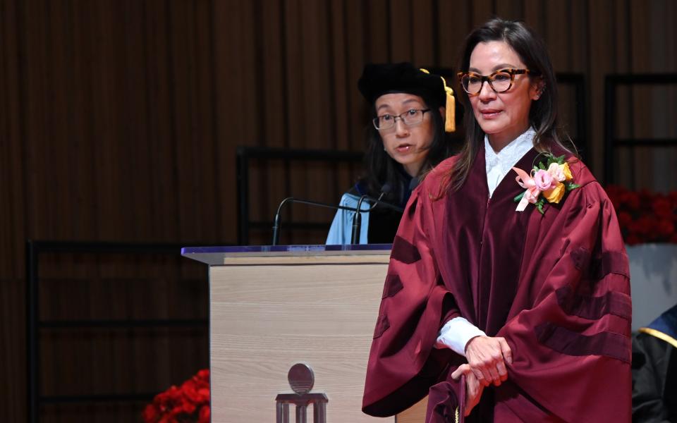 Prof Kellee Tsai, the Dean of Humanities and Social Science (left) reads honorary degree citation for Tan Sri Dato' Seri Michelle YEOH Choo-Kheng (right)